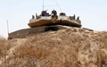 パレスチナ自治区ガザ地区とイスラエルとの境界付近に配置されたイスラエル軍の戦車（2018年6月8日撮影）。(c)AFP PHOTO / JACK GUEZ