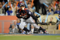 第2回ワールド・ベースボール・クラシック（%%2009 World Baseball Classic%%）決勝、韓国戦で7回にバント安打を決める日本のイチロー（%%Ichiro Suzuki%%）。（2009年3月23日撮影）(c)AFP/Getty Images/Kevork Djansezian