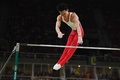 リオデジャネイロ五輪、体操男子予選。鉄棒の演技に臨む田中佑典（2016年8月6日撮影）。(c)AFP/Ben STANSALL