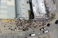 ソロモン諸島の首都ホニアラの中華街で、燃やされた建物を捉えた映像の一場面（2021年11月26日撮影）。(c)Jay Liofasi / AFP