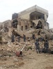 シリア北部アレッポ（Aleppo）で、政府軍の拠点として利用され、反体制派によって爆破されたホテル（2014年5月8日撮影）。(c)AFP