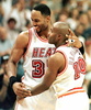 Miami Heat center Alonzo Mourning (L) and Tim Hardaway (R) celebrate as the New York Knicks called a time out with less than two seconds left after a basket by Heat forward Jamal Mashburn put them ahead in their second-round divisional playoff game 88-84. (c)AFP/RHONA WISE