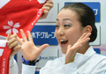 フィギュアスケート、地域対抗戦のジャパンオープン（Japan Open 2013）。自身の得点に笑顔を見せる浅田真央（Mao Asada、2013年10月5日撮影）。(c)AFP/KAZUHIRO NOGI