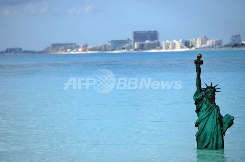 沈みゆく世界の観光名所・・・進まぬ温暖化会議に抗議