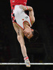 リオデジャネイロ五輪、体操男子予選。鉄棒の演技に臨む田中佑典（2016年8月6日撮影）。(c)AFP/Ben STANSALL