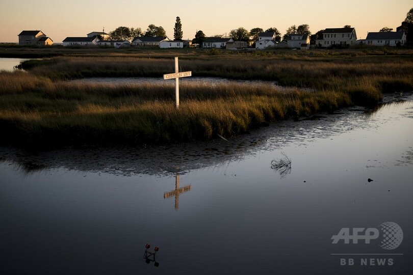 【AFP記者コラム】海面上昇で沈みゆく島に住み続ける人たち