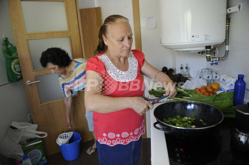経済危機のスペイン、空きビルを占拠する家族らの現状